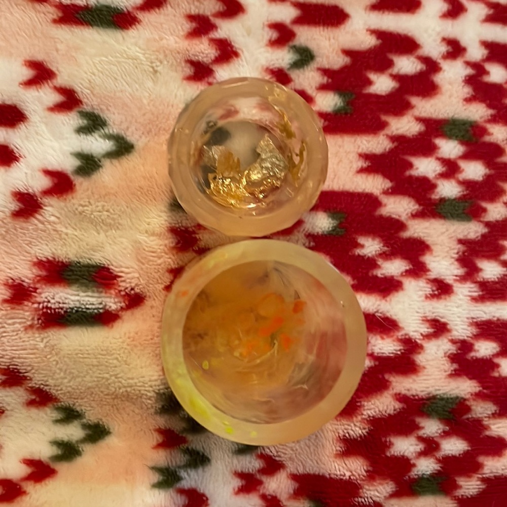 Two small resin containers.
